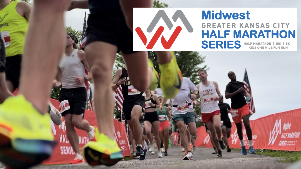 Runners participating in the Midwest Greater Kansas City Half Marathon Series. The event banner is visible in the background.