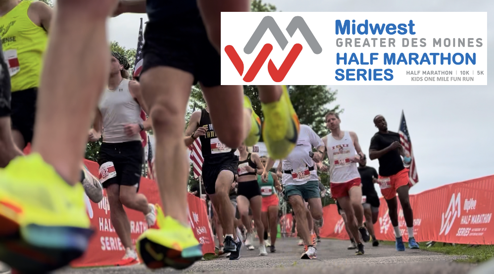 Runners participating in the Midwest Greater Des Moines Half Marathon Series, with a banner detailing event information in the background.